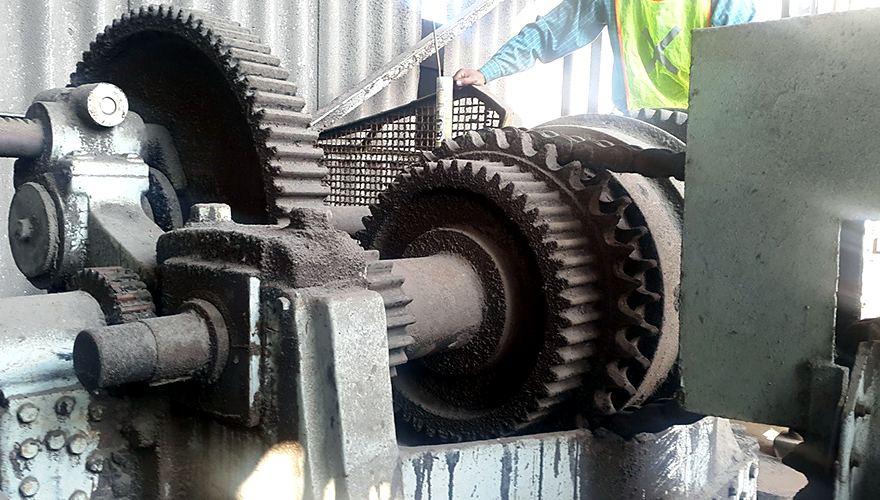 Lathe gear train before reconditioning, caked in grime and rust